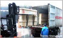 Load wooden cases into the container